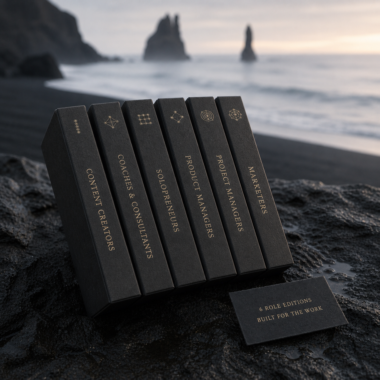 Six charcoal cartridges labelled for Content Creators, Coaches & Consultants, Solopreneurs, Product Managers, Project Managers and Marketers form a restrained fan on wet black basalt