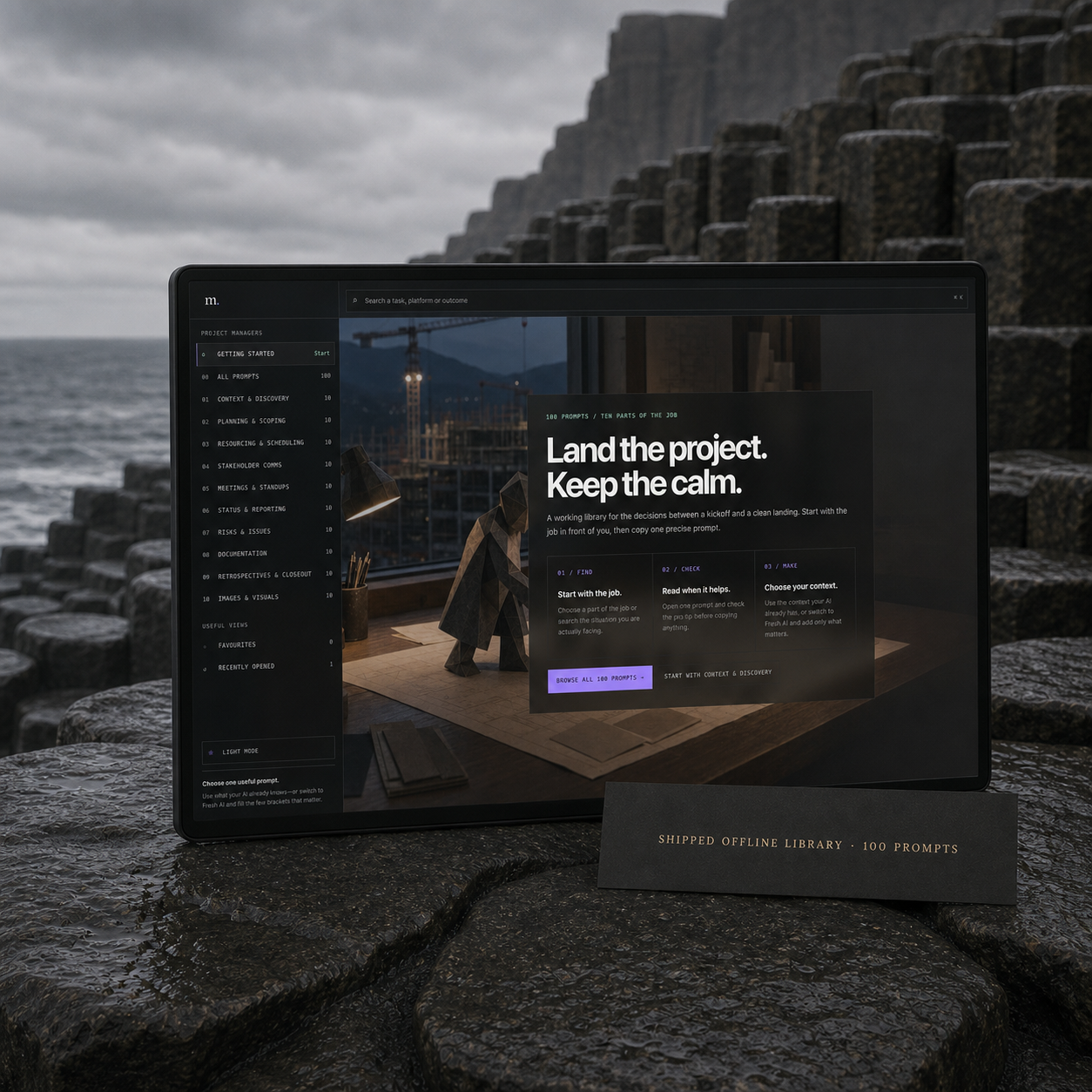 The shipped Project Managers prompt-library interface appears on a dark display beside a basalt coast